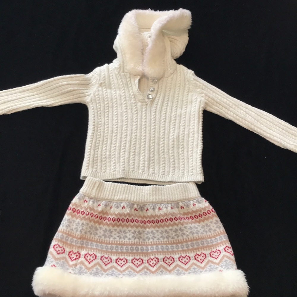 Two piece matching hoodie and skirt set.